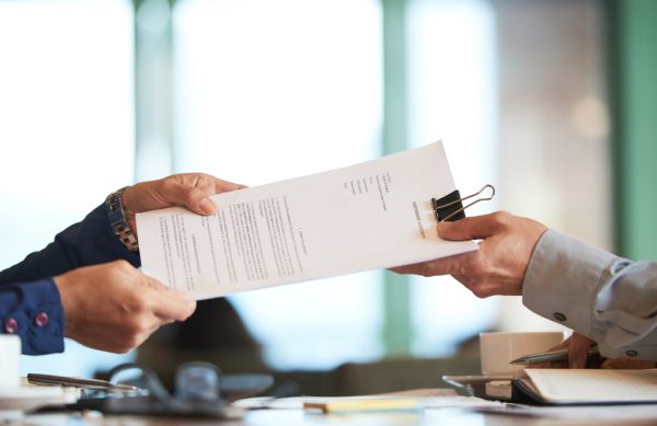 closeup-hands-passing-contract-unrecognizable-businessman (1)